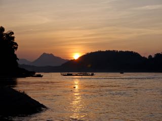 sunset over the mekong. luang prabang.