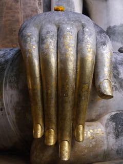 fresh mani for an old buddha. sukhothai.