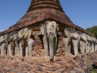 elephants surrounding a stupa. sukhothai.