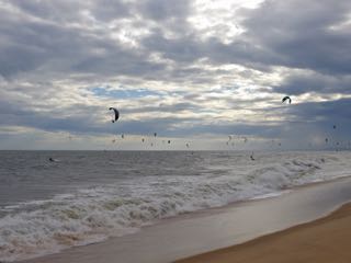 kite boarders along the mui ne coast.